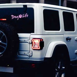 back of white jeep with a pink Dog Life vinyl decal on back window