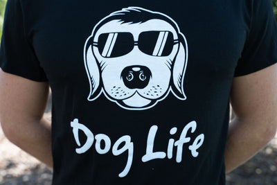 Close up of man wearing dog life tee shirt with face of dog on the shirt