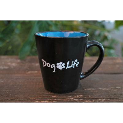 Dog Life coffee mug, black with blue inside on a brown picnic table.  Dog Life coffee mug for sale.